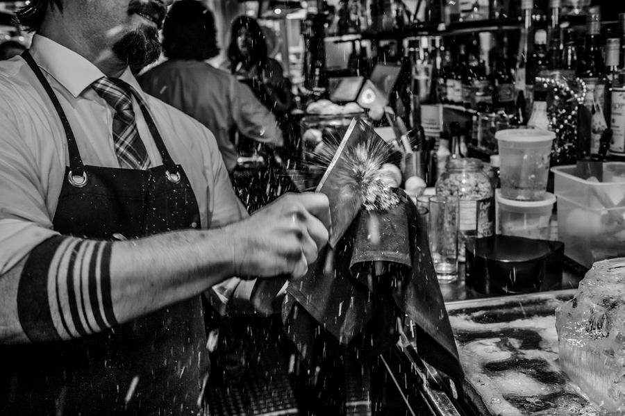 DSCF8073 | Sobou New Orlenas by popular Atlanta travel blog: image of a bar tender chopping ice. 